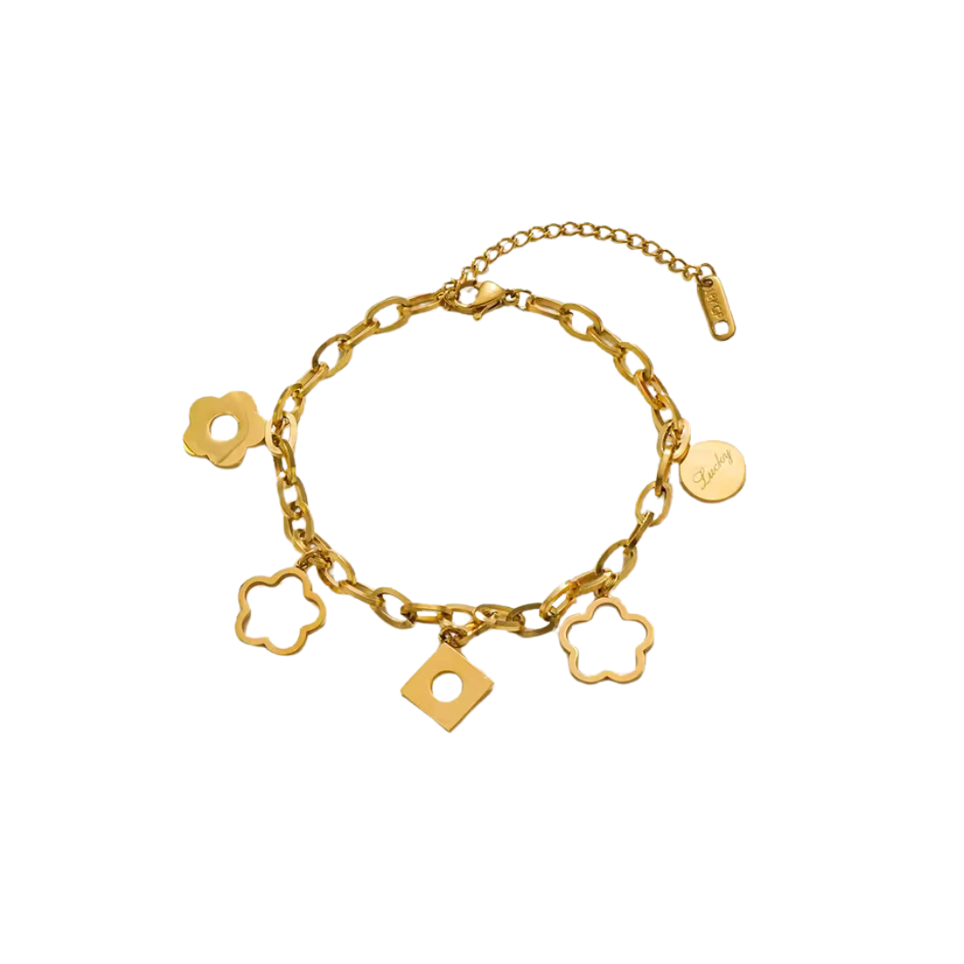 Pulsera en acero con dijes de flor con baño de oro