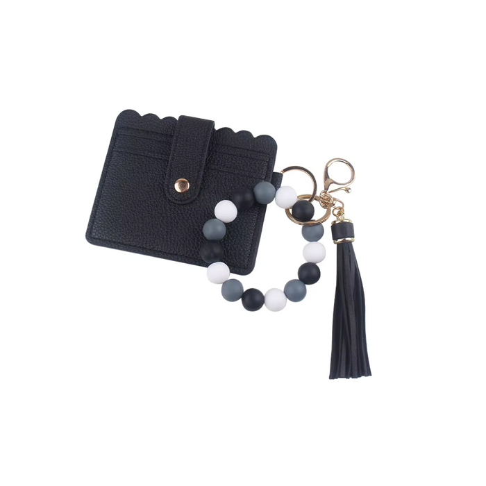 Llavero pulsera con cuentas negras y blancas, tarjetero negro con broche y fleco colgante