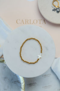 Pulsera de cuentas y cruz de acero dorado