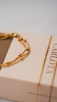 Pulsera triple en acero dorado con cuentas de joyería CARLOTA