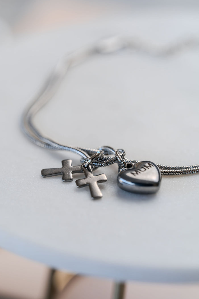 Pulsera de acero doble con dijes corazon y cruz