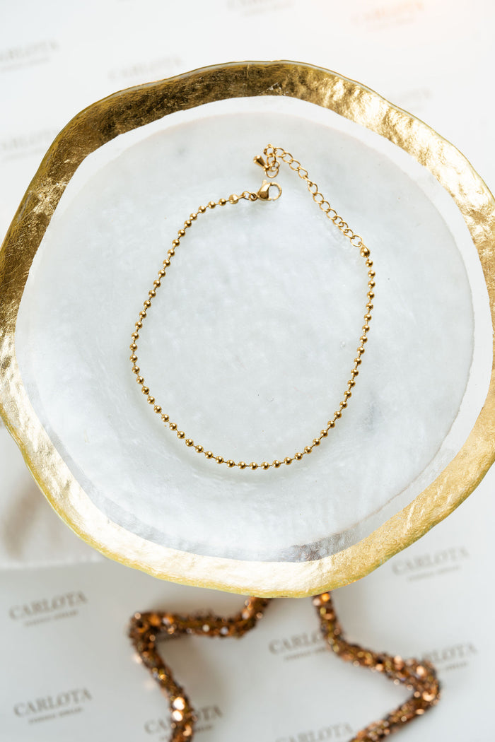 Tobillera dorada de bolitas en acero quirúrgico