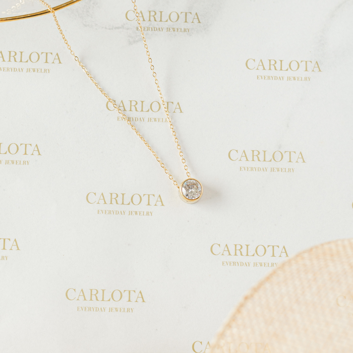 Collar punto de luz dorado de acero quirúrgico con circonia CARLOTA